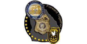 DeKalb County police badges and Georgia map surrounded by stars, with the words "Forward Together".